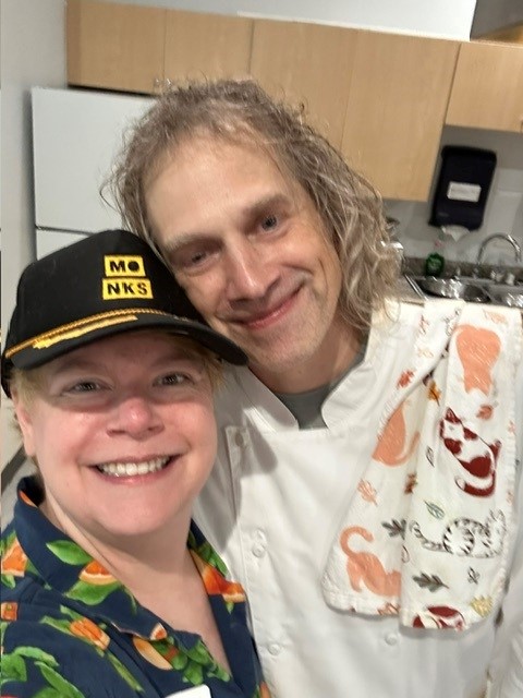 Sammy Birdwell and Chef Chris smiling together in the teaching kitchen.